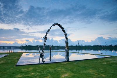 Scenic view of lake against sky during sunset