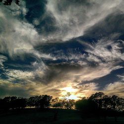 Scenic view of landscape against cloudy sky