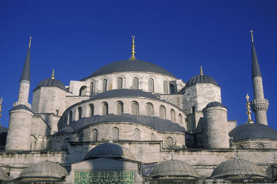 Low angle view of a building against blue sky