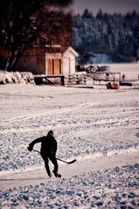 Man on snowy field during winter