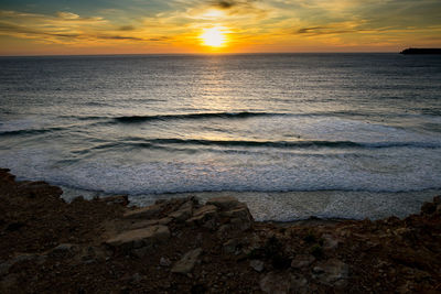 Scenic view of sea against sky during sunset