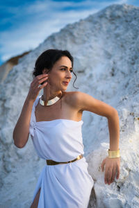 Young woman standing on beach