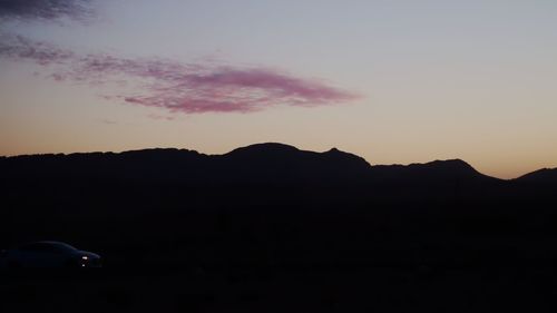 Silhouette mountain against sky during sunset