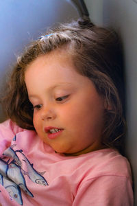 Close-up portrait of cute girl at home