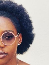 Close-up portrait of young man wearing sunglasses