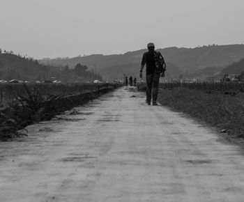 Full length of woman walking on landscape