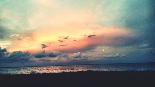 Scenic view of sea against sky at sunset