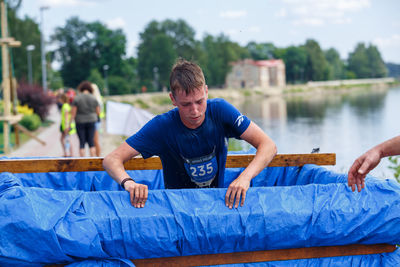 Full length of man and daughter in water