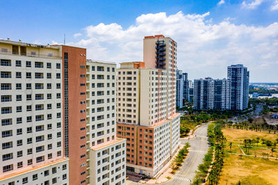 Buildings in city against sky