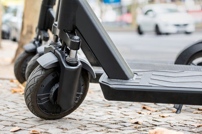 Close-up of electric push scooter on street