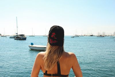 Rear view of woman looking at harbor