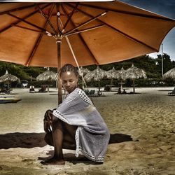 Portrait of young man sitting outdoors