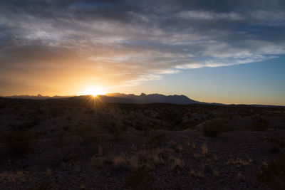 Scenic view of landscape against sky during sunset