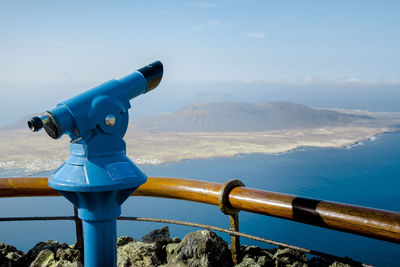 Scenic view of mountains against blue sky