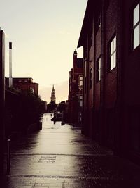 Empty alley amidst buildings in city