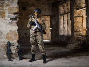 Full length of man standing against old building