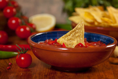 Close-up of nachos with sauce on table