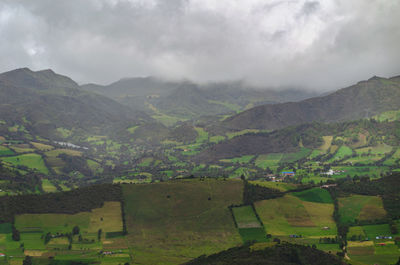 Scenic view of landscape and mountains against sky