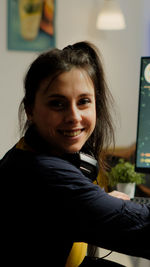 Portrait of smiling woman at home