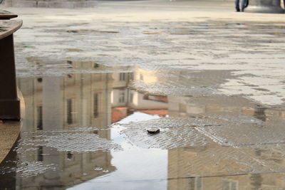 High angle view of building in puddle during winter