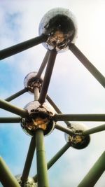 Low angle view of metal against sky