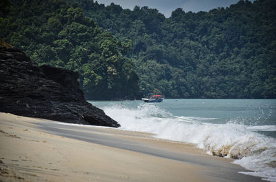 Scenic view of sea against mountain