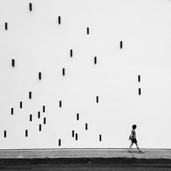Woman standing against wall