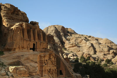 Low angle view of rock formation against clear sky