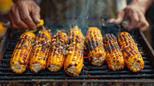 Cropped hand of man preparing food