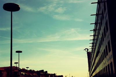 Low angle view of building against cloudy sky