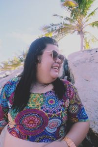 Portrait of a smiling young woman outdoors