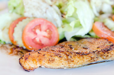 Close-up of meat on barbecue grill