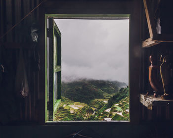 Scenic view of mountains seen through window