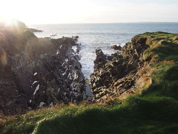 Scenic view of sea and cliff