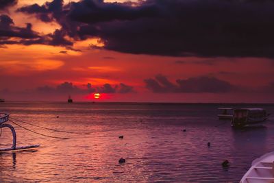 Scenic view of sea against orange sky