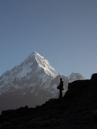 Scenic view of mountains against clear blue sky