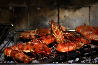 Close-up of meat on barbecue grill