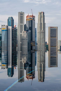 Modern buildings in city against sky