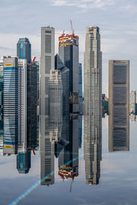 Modern buildings in city against sky