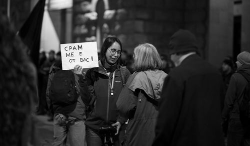 People standing on street in city