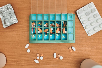 Pill dispenser. healthcare and old age concept with medicines. medicaments on table