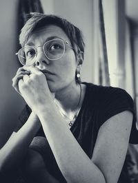 Portrait of young woman looking away