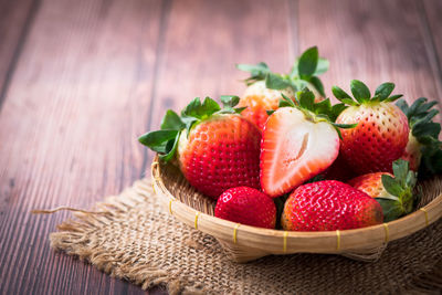 Close-up of strawberries in basket on table