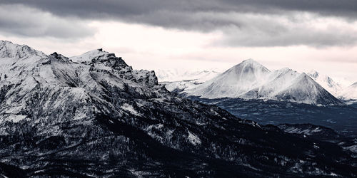 Scenic view of snowcapped mountains against sky