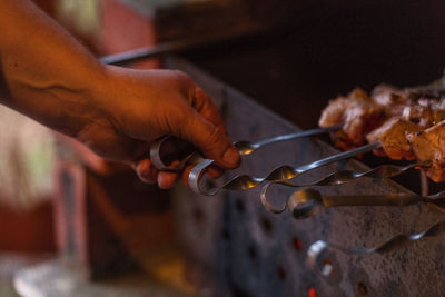 Close-up of man preparing food