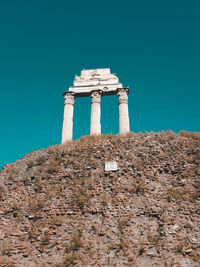 Low angle view of historical building against blue sky