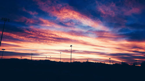 Silhouette mountains against sky during sunset