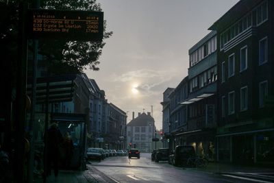 Street amidst buildings against sky in city