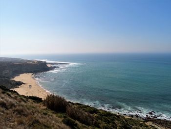 Scenic view of sea against clear blue sky