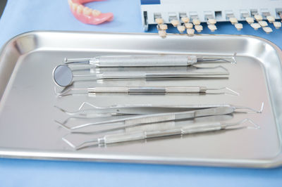 High angle view of dental equipment in tray on table